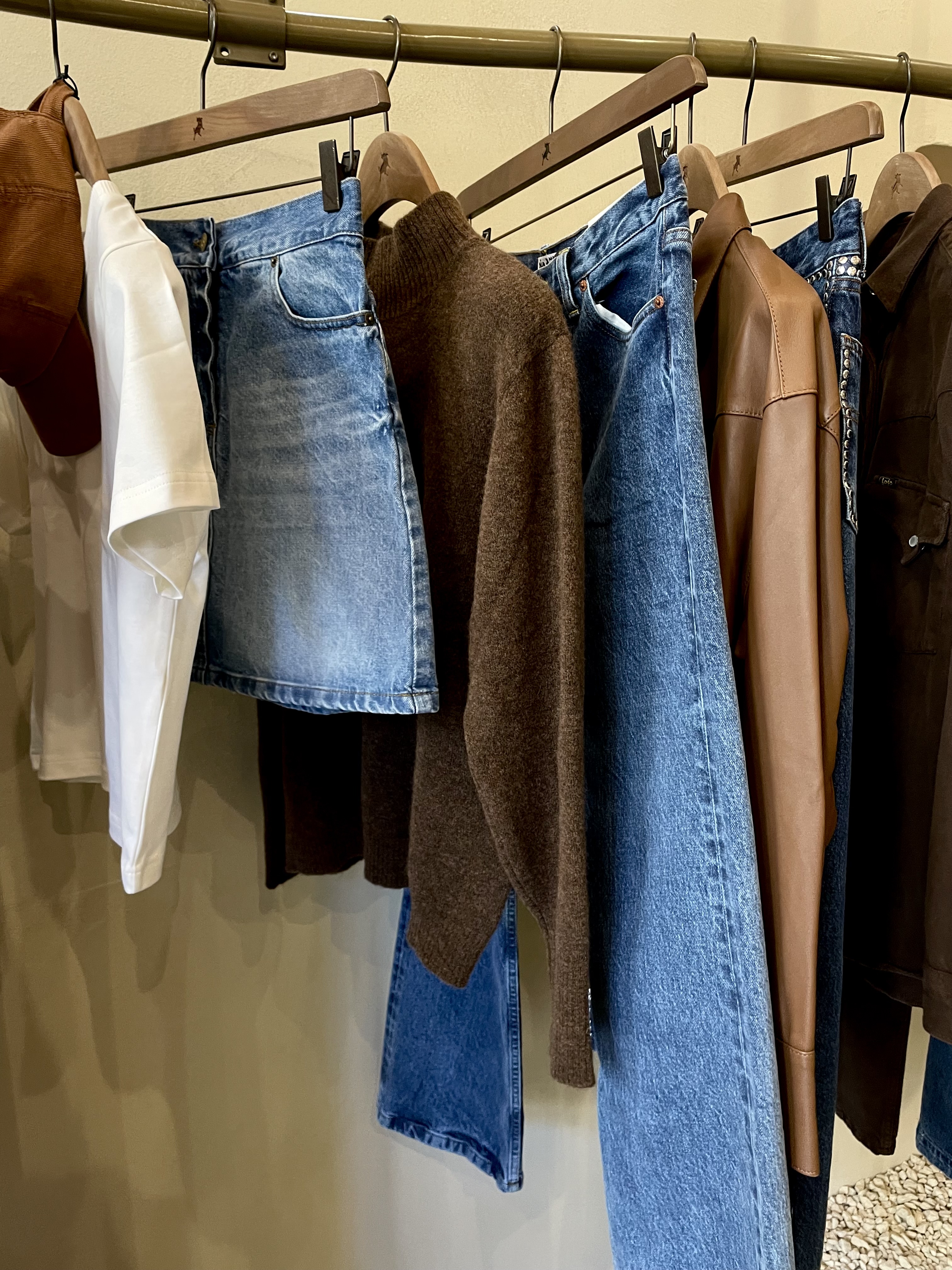 A rail of neutral-toned clothing