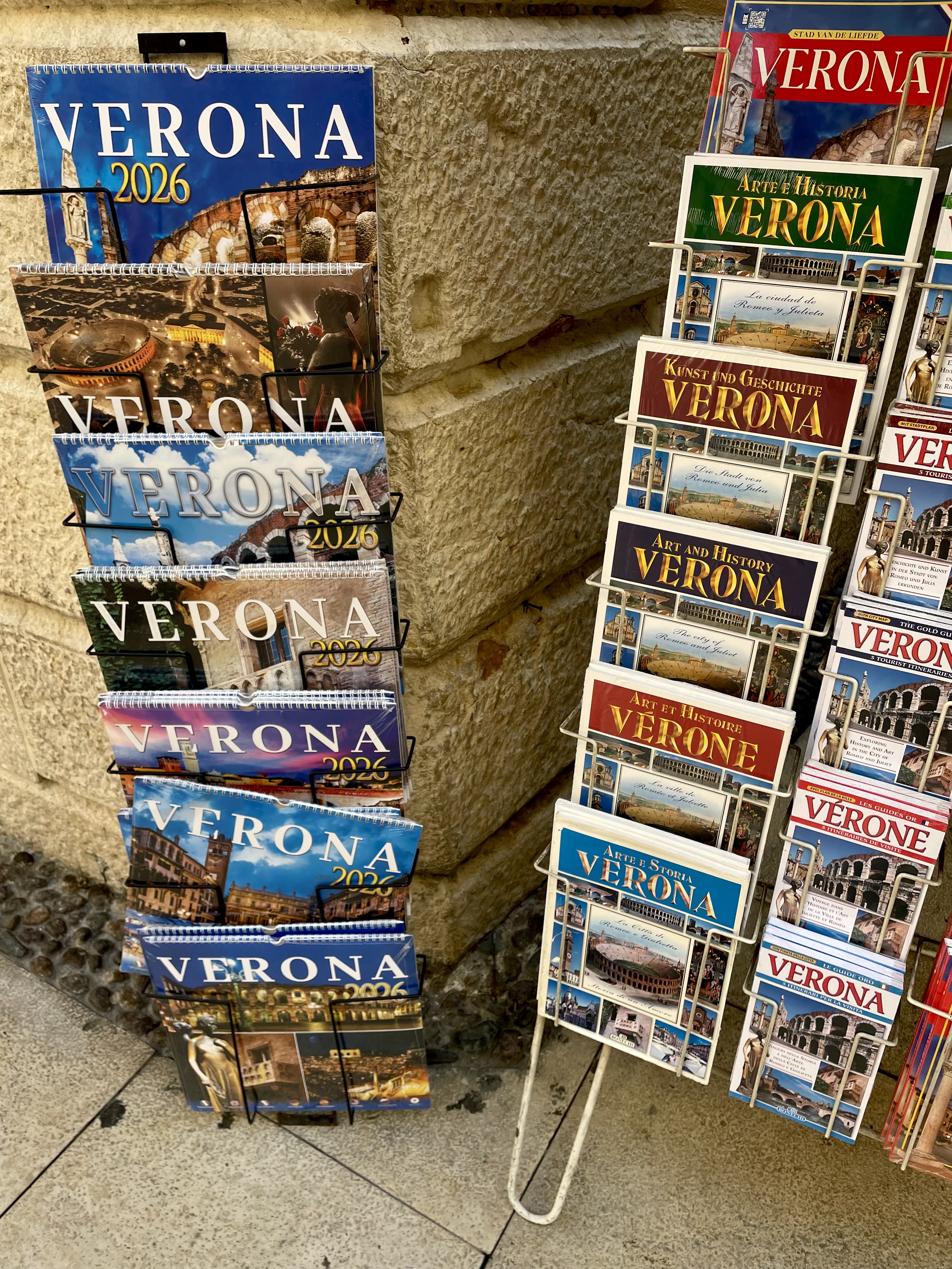 A postcard stand on a street in Verona